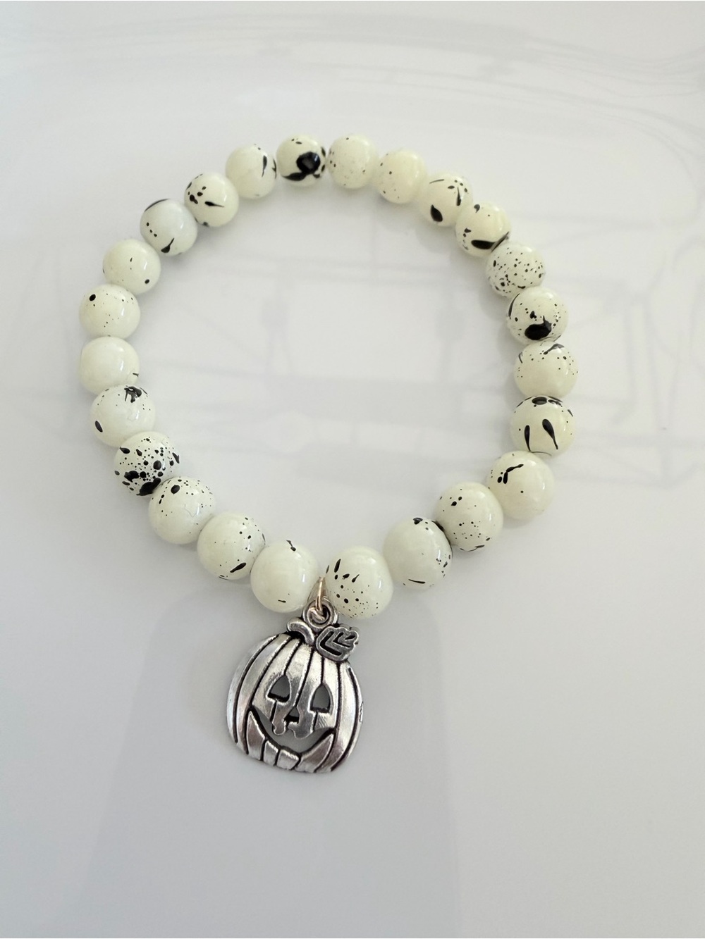 Speckled White Bead Bracelet with Silver Pumpkin Charm